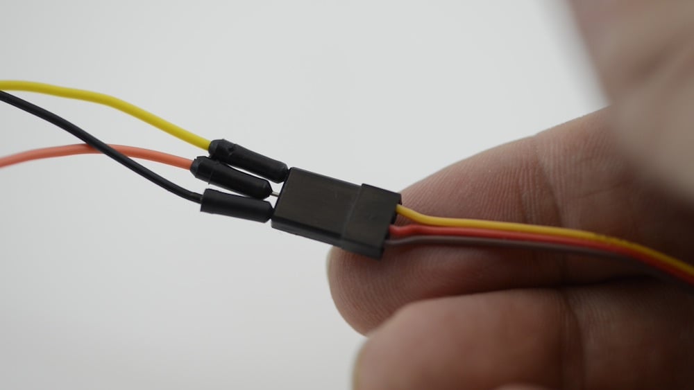 Insert jumper wires into the servo connector
